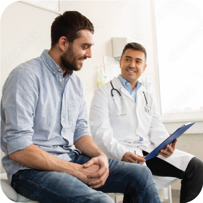 Smiling doctor and young man meeting at hospital.