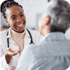 Smiling woman or doctor consulting a patient in hospital for healthcare feedback or support.